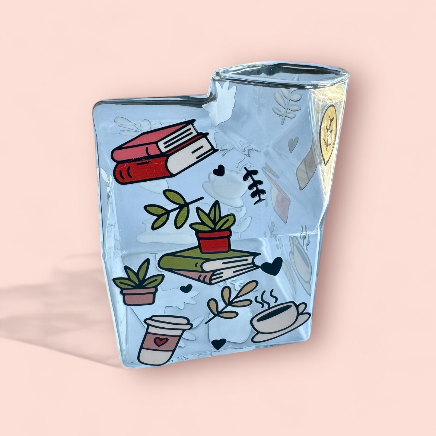 Milk glass cup- books and plants